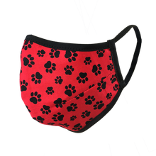 Load image into Gallery viewer, Namaske reusable fabric face mask with black paw prints on red fabric